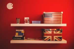Boxes with American and British flag on a shelf - gettin along.