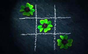 X-O with four-leaf clovers - make the smart calls when you build your small business.