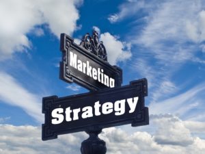 A sign depicting Marketing and Strategy