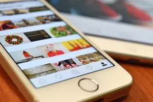 A smartphone with someone's Instagram profile opened; the color red is dominating in what is a thoroughly consistent aesthetic (perhaps the owner of this profile read our Instagram marketing tips).