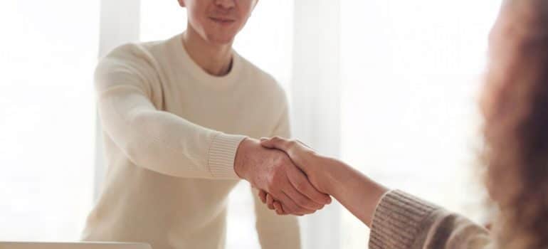 Person shaking hands with a client