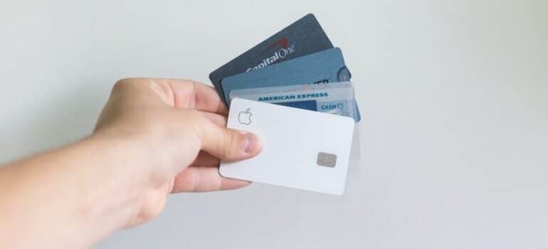 A series of credit cards, including Apple's white one, representing marketing fails.