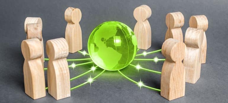 Illustration of pawns connected to a 3D model of Earth