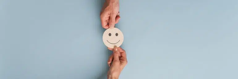 People exchanging a smiley face