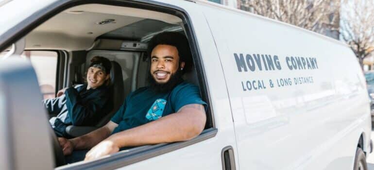two movers in a moving van