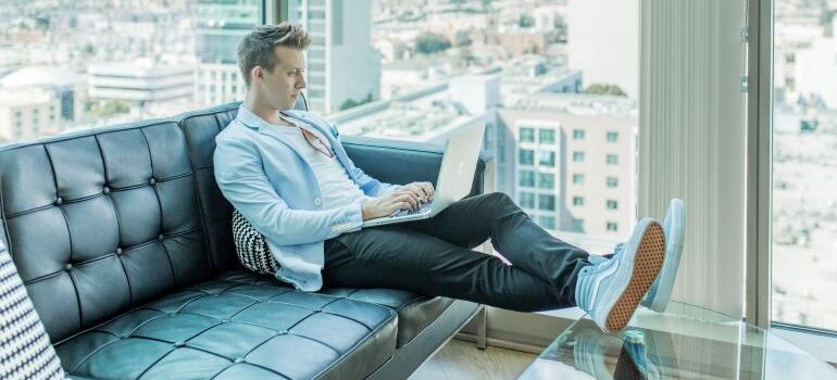 Person on sofa in high-rise office