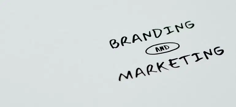 "Branding and marketing" written on white paper. 