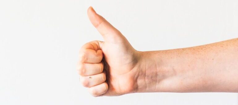A satisfied customer gives a thumbs up for Free marketing for moving companies