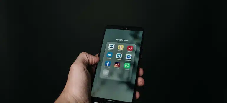 Social media apps on a phone screen.