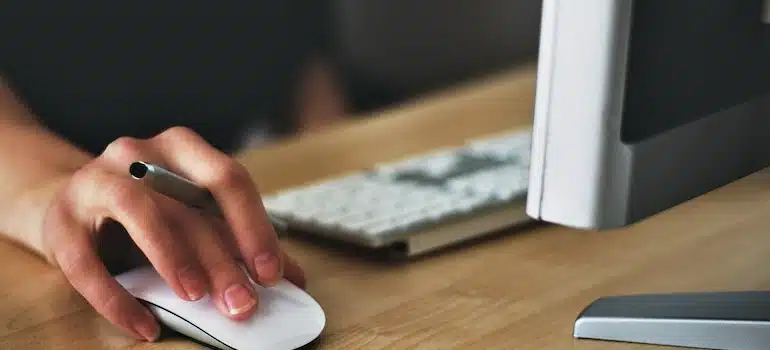 A person clicking on a computer mouse