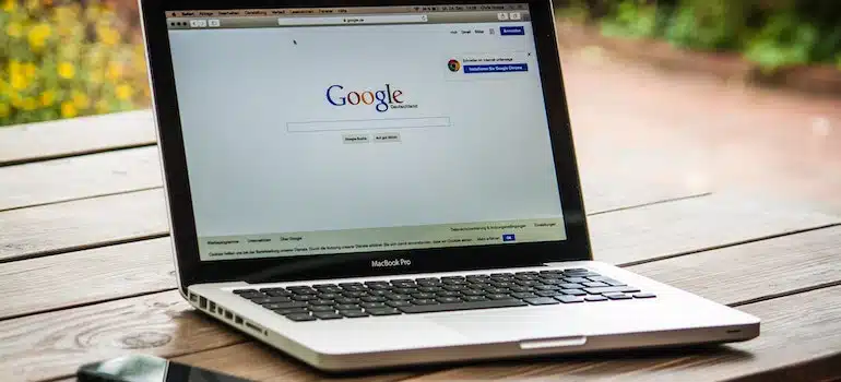 A laptop with an open Google search page