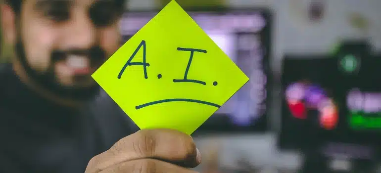 Person holding a post-it note with A.I. written on it