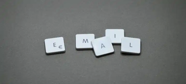 Email tiles on a gray background, illustrating how to use digital marketing to address customer objections through email campaigns.
